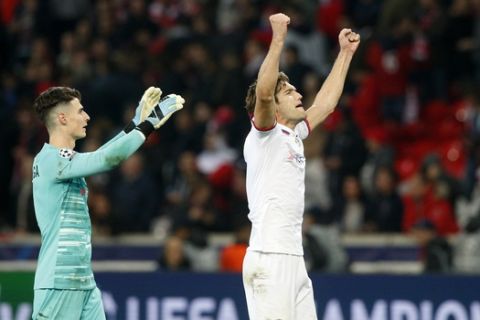Chelsea's goalkeeper Kepa Arrizabalaga, left and Chelsea's Marcos Alonso celebrate at the end of the group H Champions League soccer match between Lille and Chelsea at the Stade Pierre Mauroy - Villeneuve d'Ascq stadium in Lille, France, Wednesday, Oct. 2, 2019. Chelsea won 2:1. (AP Photo/Michel Spingler)