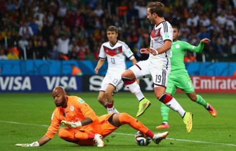 PORTO ALEGRE, BRAZIL - JUNE 30:  Rais M'Bolhi of Algeria saves a shot by Mario Goetze of Germany during the 2014 FIFA World Cup Brazil Round of 16 match between Germany and Algeria at Estadio Beira-Rio on June 30, 2014 in Porto Alegre, Brazil.  (Photo by Jamie Squire/Getty Images)