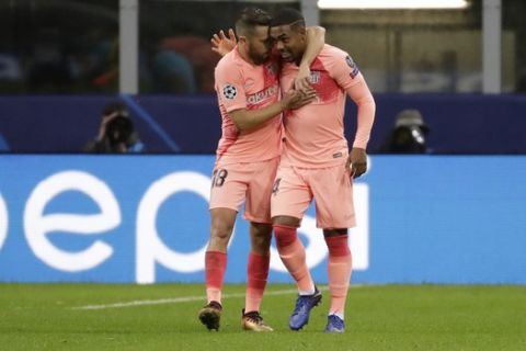Barcelona forward Malcom, right, celebrates after scoring his side's opening goal with his teammate Barcelona defender Jordi Alba during the Champions League group B soccer match between Inter Milan and Barcelona at the San Siro stadium in Milan, Italy, Tuesday, Nov. 6, 2018. (AP Photo/Luca Bruno)