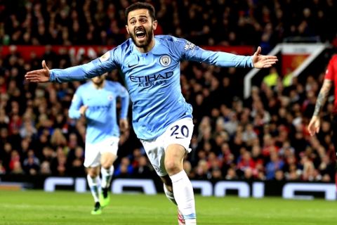 Manchester City's Bernardo Silva celebrates after scoring the opening goal during the English Premier League soccer match between Manchester United and Manchester City at Old Trafford Stadium in Manchester, England, Wednesday April 24, 2019. (AP Photo/Jon Super)