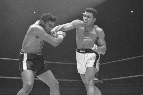 Heavyweight champion  Muhammad Ali  ( Cassius Clay)  moves in with a series of amsshes to the face of challenger Floyd Patterson in the sixth round of their title fight at Las Vegas, Nevada on Nov. 22, 1965. (AP Photo)