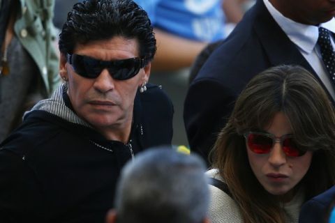 BELO HORIZONTE, BRAZIL - JUNE 21:  Diego Maradona (L) and his daughter Giannina Maradona look on during the 2014 FIFA World Cup Brazil Group F match between Argentina and Iran at Estadio Mineirao on June 21, 2014 in Belo Horizonte, Brazil.  (Photo by Ian Walton/Getty Images)