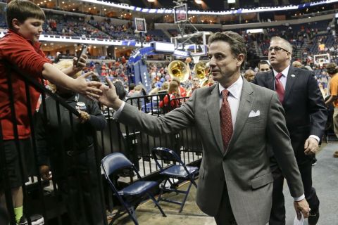Louisville coach Rick Pitino shakes hands as he leaves the court after Louisville defeated Houston 94-65 in an NCAA college basketball game in the semifinals of the American Athletic Conference men's tournament Friday, March 14, 2014, in Memphis, Tenn. (AP Photo/Mark Humphrey)