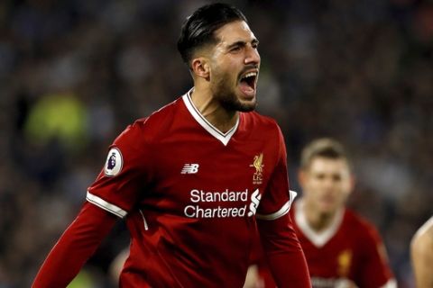 Liverpool's Emre Can celebrates scoring his side's first goal of the game against Huddersfield Town during their English Premier League soccer match at the John Smith's Stadium in Huddersfield, England, Tuesday Jan. 30, 2018. (Martin Rickett/PA via AP)