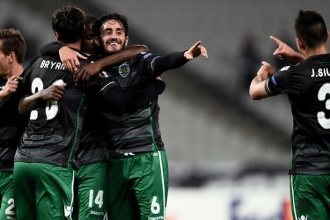 Sporting Lisbon's forward Bryan Ruiz (2nd) celebrates with his teammates Alberto Aquilani (2nd R) and Jonathan Silva (R) after scoring a goal during the UEFA Europa League group H football match between Besiktas Istanbul and Sporting CP at the Ataturk Olimpiyat Stadium in Istanbul on October 1, 2015. AFP PHOTO / OZAN KOZE        (Photo credit should read OZAN KOZE/AFP/Getty Images)