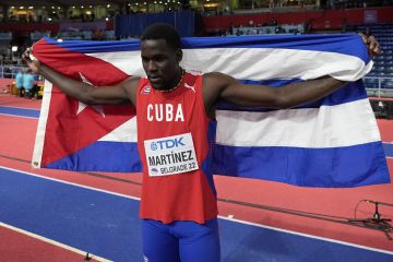 Lazaro Martinez, of Cuba, celebrates after winning the Men's triple jump at the World Athletics Indoor Championships in Belgrade, Serbia, Friday, March 18, 2022. (AP Photo/Darko Vojinovic)
