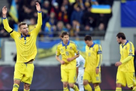 Ukraine's Andriy Yarmolenko (L) celebrates after scoring against Slovenia in the Euro 2016 play-off football match between Ukraine and Slovenia at the Arena Lviv stadium in Lviv on November 14, 2015.   AFP PHOTO/ SERGEI SUPINSKY        (Photo credit should read SERGEI SUPINSKY/AFP/Getty Images)