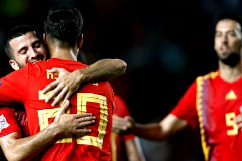 Spain's Marco Asensio, front, celebrates with teammates after scoring his side's second goal during the UEFA Nations League soccer match between Spain and Croatia at the Manuel Martinez Valero stadium in Elche, Spain, Tuesday Sept. 11, 2018. (AP Photo/Alberto Saiz)