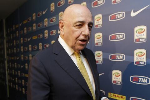 AC Milan vice president Adriano Galliani leaves the Lega calcio headquarter in Milan, Italy, Friday, March 6, 2015. Serie A has voted to provide crisis-hit Parma with a 5 million euro ($5.5 million) emergency fund to help the club finish the season. Sixteen of the 20 clubs in the top Italian league voted in favor of the measure Friday, three abstained and Cesena had the only vote against the move. The measure means last-place Parma should be able to play Atalanta on Sunday after its previous two matches were postponed indefinitely with the club unable to pay for basic services like security and electricity.(AP Photo/Luca Bruno)