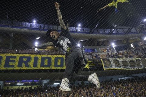 Fans of Boca Juniors cheer prior to a Copa Libertadores semifinal second leg soccer match against River Plate at La Bombonera stadium in Buenos Aires, Argentina, Tuesday, Oct. 22, 2019. (AP Photo/Daniel Jayo)