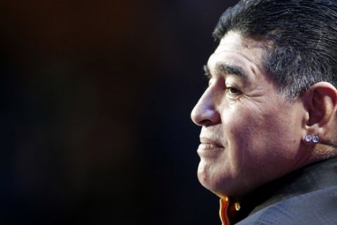 Argentine soccer legend Diego Maradona stands on stage during the 2018 soccer World Cup draw in the Kremlin in Moscow, Friday Dec. 1, 2017. (AP Photo/Alexander Zemlianichenko)