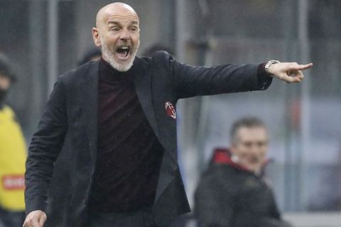 AC Milan's manager Stefano Pioli gives instructions during the Serie A soccer match between AC Milan and Torino at the San Siro stadium, in Milan, Italy, Monday, Feb. 17, 2020. (AP Photo/Antonio Calanni)
