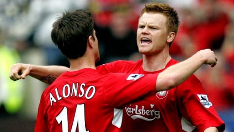 Liverpool's John Arne Risse, right, celebrates with team mate Xabi Alonso, left, after scoring against Chelsea during their English FA Cup semi final soccer match at Old Trafford, Manchester, England, Saturday April 22, 2006. (AP Photo/Dave Thompson)