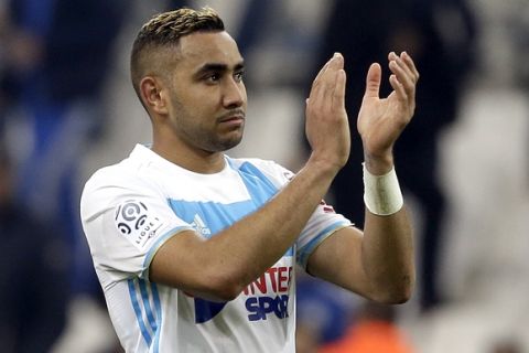 Marseille's Dimitri Payet applauds supporters after the League One soccer match between Marseille and Paris Saint-Germain, at the Velodrome Stadium, in Marseille, southern France, Sunday, Feb. 26, 2017. (AP Photo/Claude Paris)