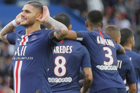 PSG's Mauro Icardi gestures as he acknowledges applause for his side second goal during French League One soccer match between PSG and Angers at the Parc des Princes stadium in Paris, Saturday, Oct. 5, 2019. (AP Photo/Michel Euler)