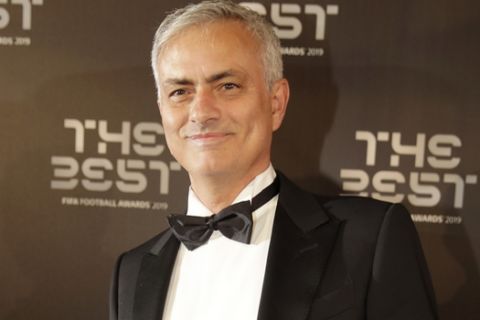 Former Manchester United and Chelsea soccer team manager Jose Mourinho arrives to attend the Best FIFA soccer awards, in Milan's La Scala theater, northern Italy, Monday, Sept. 23, 2019. Netherlands defender Virgil van Dijk is up against five-time winners Cristiano Ronaldo and Lionel Messi for the FIFA best player award and United States forward Megan Rapinoe is the favorite for the women's award. (AP Photo/Luca Bruno)