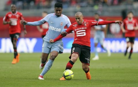 Rennes' Wahbi Khazri, right, challenges with Monaco's defender Jemerson during their French League One soccer match in Rennes, western France, Wednesday, April 4, 2018.(AP Photo/David Vincent)