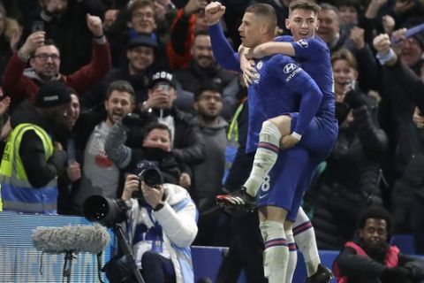 Chelsea's Ross Barkley, left, gestures to supporters after scoring his team's second goal as teammate Billy Gilmour embraces him during the English FA Cup fifth round soccer match between Chelsea and Liverpool at Stamford Bridge stadium in London Wednesday, March 4, 2020. (AP Photo/Kirsty Wigglesworth)
