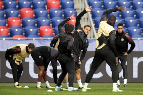 Manchester United players warm up during a training session ahead of the Champions League soccer match between CSKA Moscow and Manchester United in Moscow, Russia, Tuesday, Sept. 26, 2017. (AP Photo/Ivan Sekretarev)
