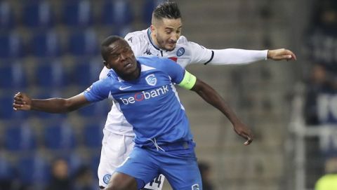 Genk's Mbwana Samatta, left, jumps for the ball with Napoli's Kostas Manolas during a Champions League group E soccer match between Genk and Napoli at the KRC Genk Arena in Genk, Belgium, Wednesday, Oct. 2, 2019. (AP Photo/Francisco Seco)