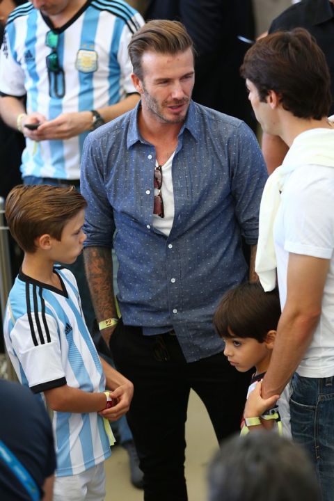 RIO DE JANEIRO, BRAZIL - JULY 13:  Former England international David Beckham and son Romeo Beckham attend the 2014 FIFA World Cup Brazil Final match between Germany and Argentina at Maracana on July 13, 2014 in Rio de Janeiro, Brazil.  (Photo by Michael Steele/Getty Images)