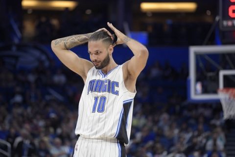 Orlando Magic guard Evan Fournier (10) adjusts his hair after a timeout during the second half of an NBA basketball game against the Charlotte Hornets in Orlando, Fla., Wednesday, March 22, 2017. The Hornets won 109-102. (AP Photo/Phelan M. Ebenhack)