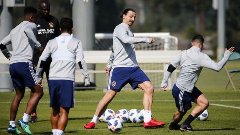 LA Galaxy's newest player Zlatan Ibrahimovic, second right, of Sweden, controls the ball during an MLS soccer training session at the StubHub Center, Friday, March 30, 2018, in Carson, Calif. (AP Photo/Ringo H.W. Chiu)