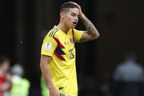 Colombia's James Rodriguez stands on the pitch after the group H match between Colombia and Japan at the 2018 soccer World Cup in the Mordavia Arena in Saransk, Russia, Tuesday, June 19, 2018. Japan won the match 2-1. (AP Photo/Natacha Pisarenko)