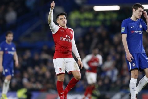 Arsenal's Alexis Sanchez gestures during the English League Cup semifinal, first leg, soccer match between Chelsea and Arsenal at Stamford Bridge stadium in London, Wednesday, Jan. 10, 2018. (AP Photo/Kirsty Wigglesworth)