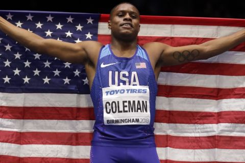 United States' Christian Coleman celebrates after winning the gold medal and setting a new championship record in the men's 60 meters race at the World Athletics Indoor Championships in Birmingham, Britain, Saturday, March 3, 2018. (AP Photo/Matt Dunham)