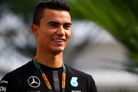 SINGAPORE - SEPTEMBER 19:  Pascal Wehrlein of Germany and Mercedes GP arrives in the paddock before final practice for the Formula One Grand Prix of Singapore at Marina Bay Street Circuit on September 19, 2015 in Singapore.  (Photo by Mark Thompson/Getty Images)