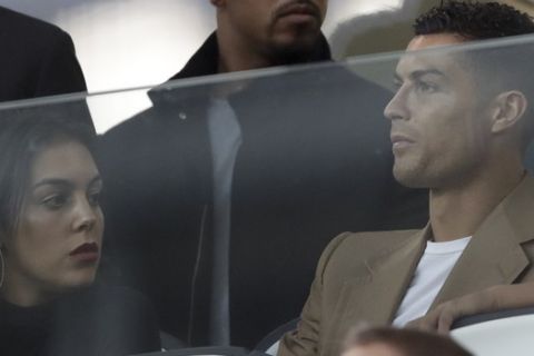 Juventus forward Cristiano Ronaldo and his partner Georgina sit in the stands prior to the Champions League, group H soccer match between Juventus and Young Boys, at the Allianz stadium in Turin, Italy, Tuesday, Oct. 2, 2018. (AP Photo/Luca Bruno)