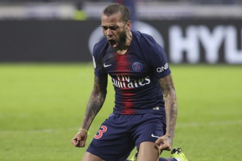 PSG's Dani Alves reacts during the French League One soccer match between Lyon and Paris Saint-Germain in Decines, near Lyon, central France, Sunday, Feb. 3, 2019. (AP Photo/Laurent Cipriani)