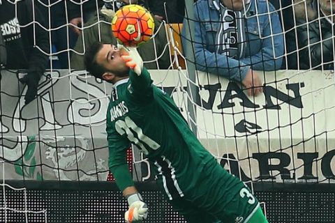 Udinese goalkeeper Orestis Karnezis, left, saves on Lazio's Sergej Milinkovic-Savic, during the Serie A soccer match between Udinese and Lazio at the Friuli Stadium in Udine, Italy, Sunday, Jan. 31, 2016. (AP Photo/Paolo Giovannini)