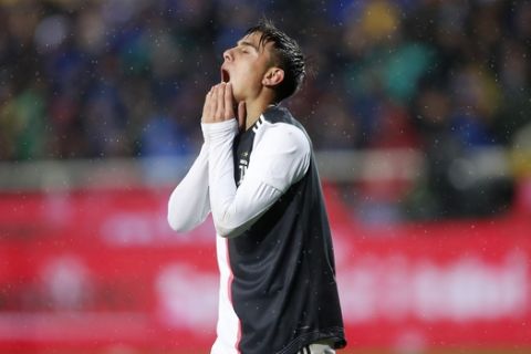 Juventus' Paulo Dybala reacts after missing a scoring chance during the Serie A soccer match between Atalanta and Juventus at the Gewiss stadium, in Bergamo, Italy, Saturday, Nov. 23, 2019. (AP Photo/Antonio Calanni)