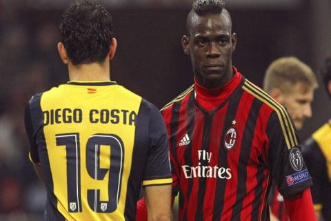 MILAN, ITALY - FEBRUARY 19:  Mario Balotelli (R) of AC Milan and Diego Costa of Club Atletico de Madrid look on during the UEFA Champions League Round of 16 match between AC Milan and Club Atletico de Madrid at Stadio Giuseppe Meazza on February 19, 2014 in Milan, Italy.  (Photo by Marco Luzzani/Getty Images)