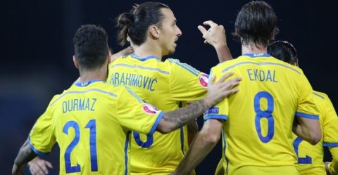 Swedens Zlatan Ibrahimovic (2nd L) celebrates with teammates Jimmy Durmaz (L) and Albin Ekdal after scoring his team's second goal during the Euro 2016 Group G qualifying football match between Liechtenstein and Sweden at the Rheinpark stadium in Vaduz on October 9, 2015.  AFP PHOTO / MICHELE LIMINA        (Photo credit should read MICHELE LIMINA/AFP/Getty Images)