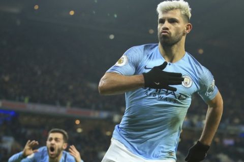 Manchester City's Sergio Aguero celebrates after scoring the opening goal of the game during their English Premier League soccer match between Manchester City and Liverpool at the Ethiad stadium, Manchester England, Thursday, Jan. 3, 2019. (AP Photo/Jon Super)