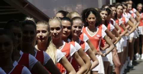 Grid girls wait in line at the end of the qualification at the Monaco racetrack in Monaco, Monaco, Saturday, May 28, 2016. The Formula one race will be held on Sunday. (AP Photo/Petr David Josek)