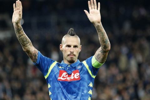 Napoli's Marek Hamsik waves his supporters at the end of the Champions League, group C, soccer match between Paris Saint Germain and Napoli at the Parc des Princes stadium in Paris, Wednesday, Oct. 24, 2018. (AP Photo/Francois Mori)