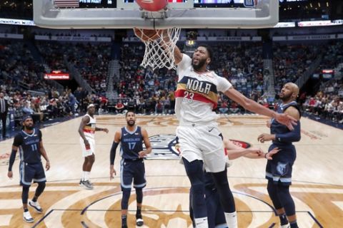 New Orleans Pelicans forward Anthony Davis (23) slam-dunks in the first half of an NBA basketball game against the Memphis Grizzlies in New Orleans, Monday, Jan. 7, 2019. (AP Photo/Gerald Herbert)