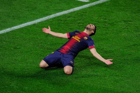 Barcelona's forward David Villa celebrates after scoring during the UEFA Champions League round of 16 second leg football match FC Barcelona against AC Milan at Camp Nou stadium in Barcelona on March 12, 2013. AFP PHOTO/ JOSEP LAGO        (Photo credit should read JOSEP LAGO/AFP/Getty Images)