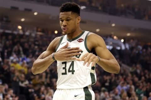 Milwaukee Bucks' Giannis Antetokounmpo reacts at the start of an NBA basketball game against the Detroit Pistons during the first half Saturday, Nov. 23, 2019, in Milwaukee. (AP Photo/Jeffrey Phelps)