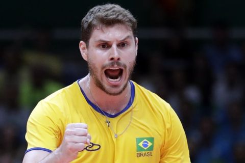 Brazil's Bruno Rezende celebrates during a men's preliminary volleyball match against Canada at the 2016 Summer Olympics in Rio de Janeiro, Brazil, Tuesday, Aug. 9, 2016. (AP Photo/Jeff Roberson)