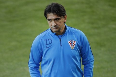 Croatia head coach Zlatko Dalic walks along the pitch during a training session in the Luzhniki sport ground at 2018 soccer World Cup in Moscow, Russia, Monday, July 9, 2018. (AP Photo/Francisco Seco)
