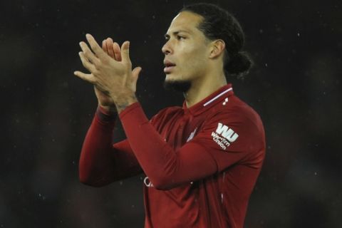Liverpool's Virgil van Dijk during the English Premier League soccer match between Liverpool and Manchester United at Anfield in Liverpool, England, Sunday, Dec. 16, 2018. (AP Photo/Rui Vieira)