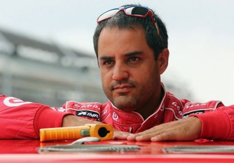 INDIANAPOLIS, IN - JULY 27:  Juan Pablo Montoya, driver of the #42 Target Chevrolet, stands in the garage area during practice for the NASCAR Sprint Cup Series Samuel Deeds 400 At The Brickyard at Indianapolis Motor Speedway on July 27, 2013 in Indianapolis, Indiana.  (Photo by Jerry Markland/Getty Images)