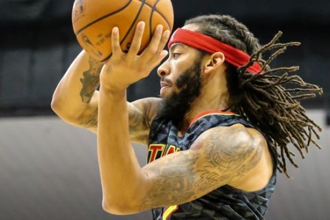 Atlanta Hawks guard Terran Petteway (2) passes the ball during the second half of an NBA preseason basketball game against the New Orleans Pelicans in Jacksonville, Fla., Friday, Oct. 9, 2015. The Hawks won 103-93. (AP Photo/Gary McCullough)