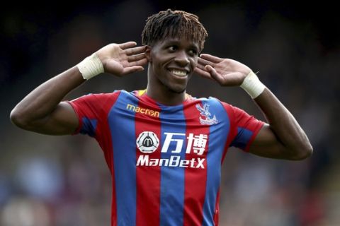 Crystal Palace's Wilfried Zaha gestures, during the English Premier League soccer match between Crystal Palace and West Ham United, at Selhurst Park, in London, Saturday Oct. 28, 2017. (John Walton/PA via AP)