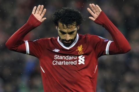 Liverpool's Mohamed Salah celebrates after scoring his side's second goal during the Champions League semifinal, first leg, soccer match between Liverpool and Roma at Anfield Stadium, Liverpool, England, Tuesday, April 24, 2018. (AP Photo/Rui Vieira)